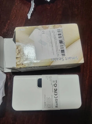 Customer photo of the white Pantria mini bag sealer with its box
